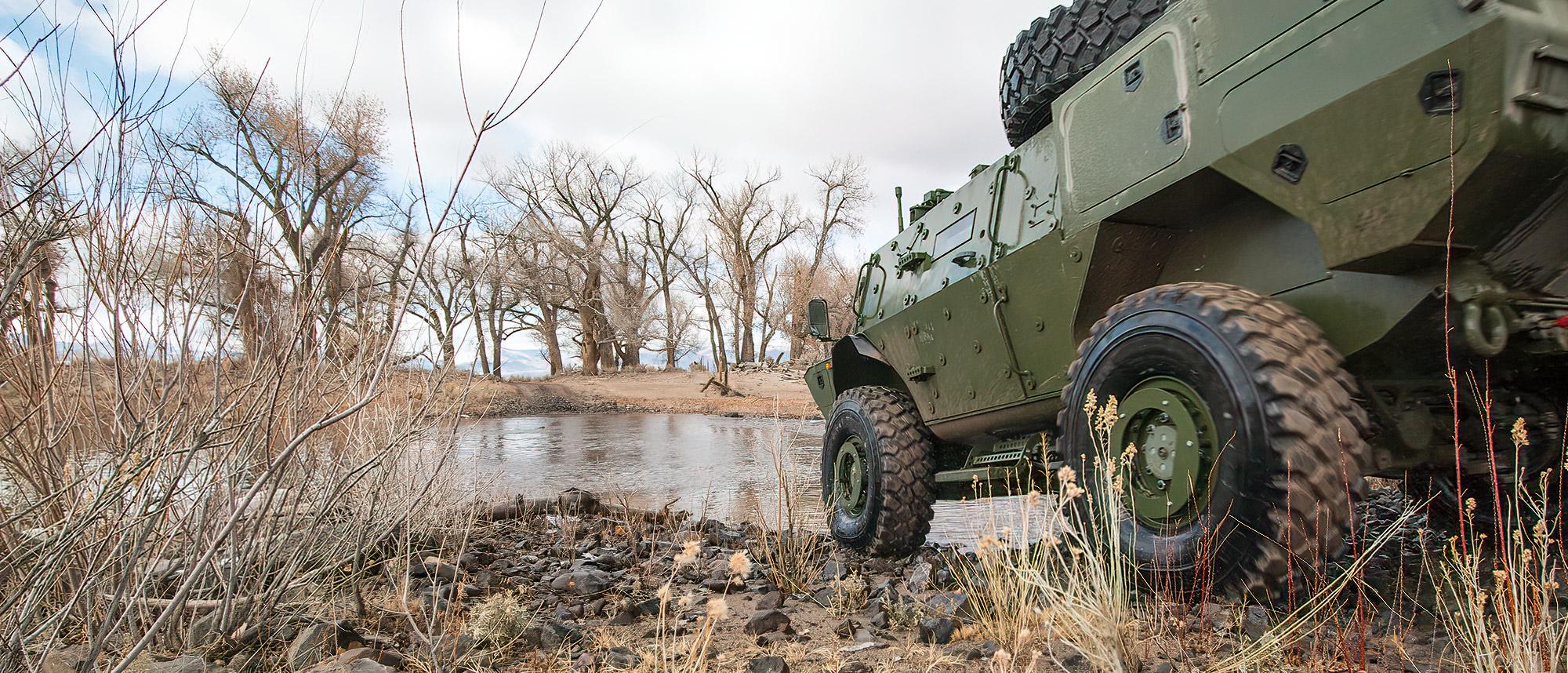 Land vehicle driving into the water