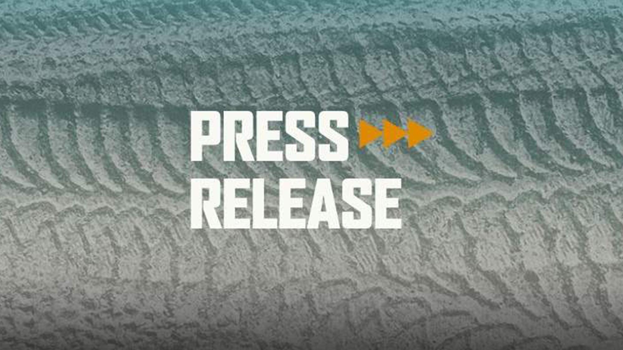 Press Release graphic with tire tracks in the sand
