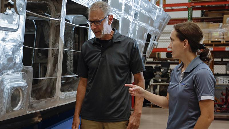 Manager with an associate at the shipyard